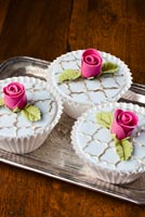 Vintage blue fondant covered cupcakes embellished with 24k gold and pink gumpaste roses 