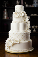 Five tier vintage button flower cake with pearls and gold trim